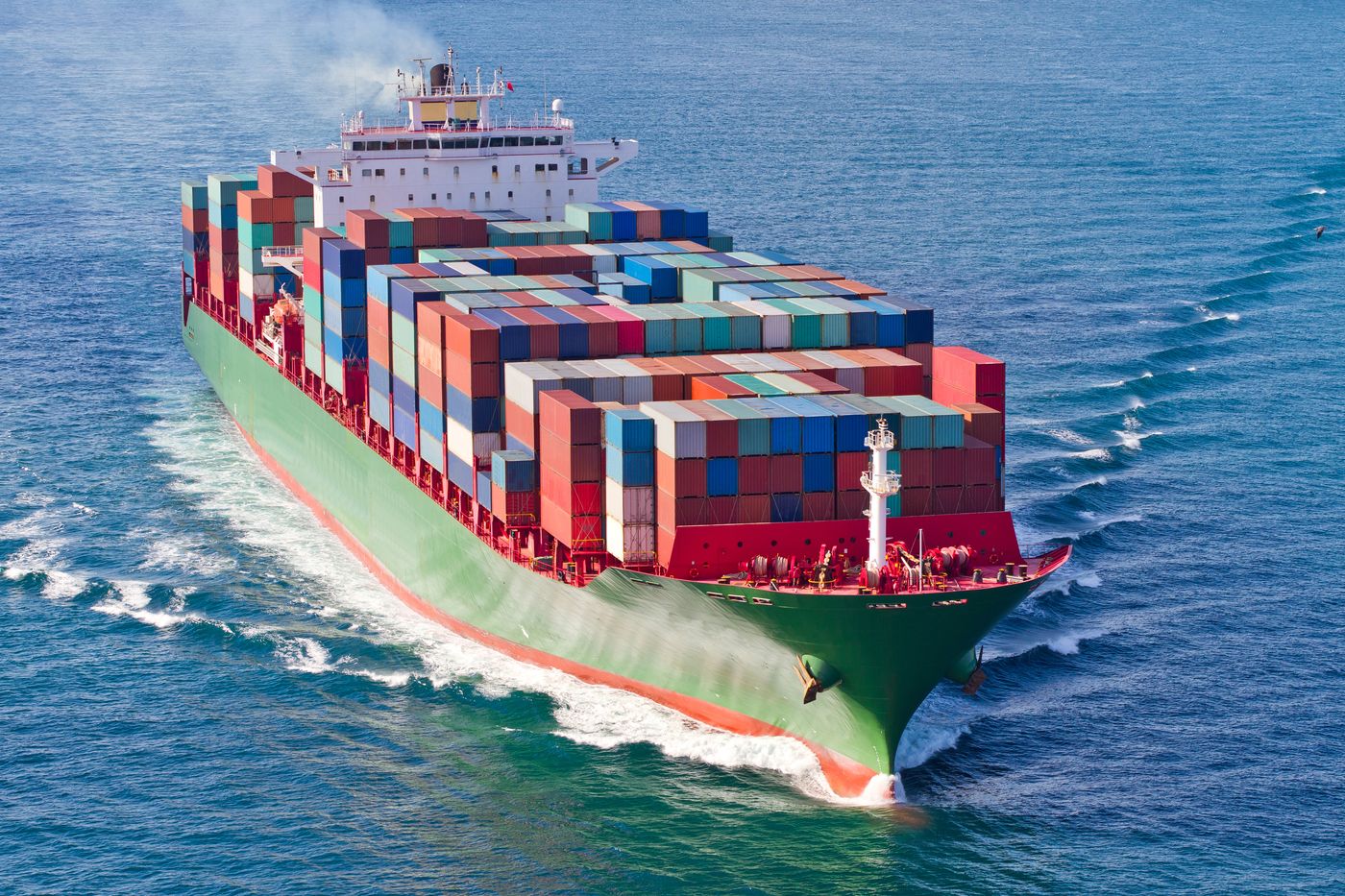 Container ship carrying freight across open water