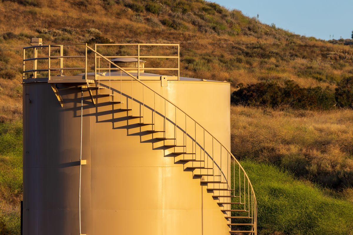 Fabricated steel storage tank with access stairway